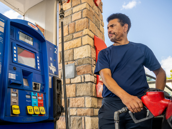 A customer pumps gas at an Exxon gas station in Houston, on July 29, 2022. U.S. oil companies are becoming a lot more restrained about production, and that could keep gas prices high over the longer term.