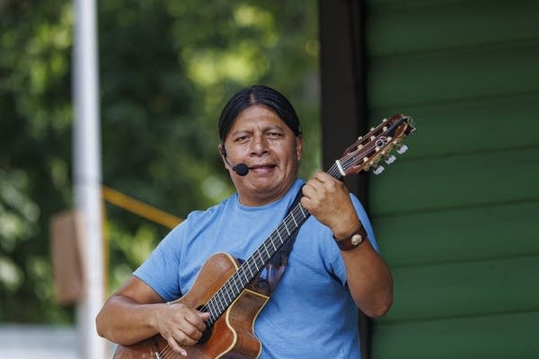 a man plays guitar