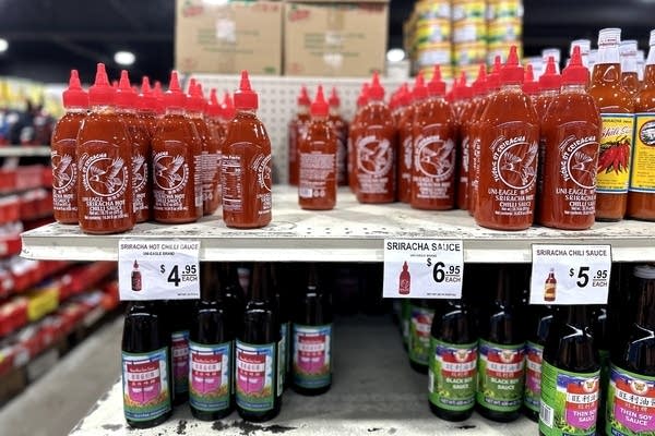 bottles of hot sauce and soy sauce on display 