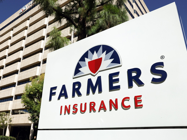 The Farmers Insurance logo is displayed outside company headquarters in Woodland Hills, Calif., on Aug. 29, 2023. Insurance companies are having to raise their auto premiums for several reasons including a rise in natural disasters and the rising cost of repairs and parts replacements.