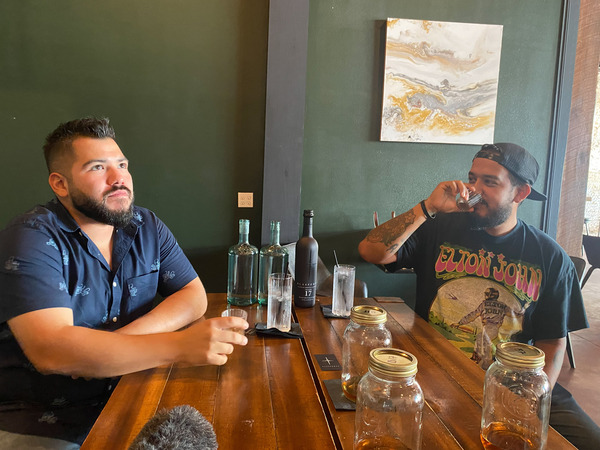 Juan Flores, co-owner of Terras Urban Mexican Kitchen (left), and Chris Galicia, cocktail spirits director of Las Ramblas, swill the Texas-made agave spirit Blasfemus.