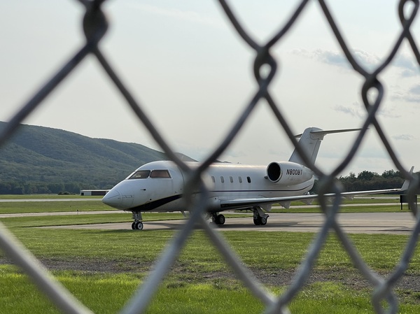 An old Challenger jet used to train students of the Pennsylvania College of Technology is seen behind a fence at Williamsport Regional Airport
