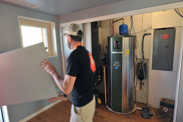 If you're thinking about a heat pump water heater, plan ahead. These heaters are taller so may need more ceiling space. And if your current water heater is powered by gas, you'll need to get electricity installed.