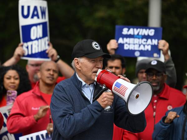 President Biden addresses striking UAW members at a picket line outside a General Motors Service Parts Operations plant in Belleville, Mich., on Sept. 26, 2023. Biden joined the picket line earlier this month, in an extraordinary show of support for striking workers.