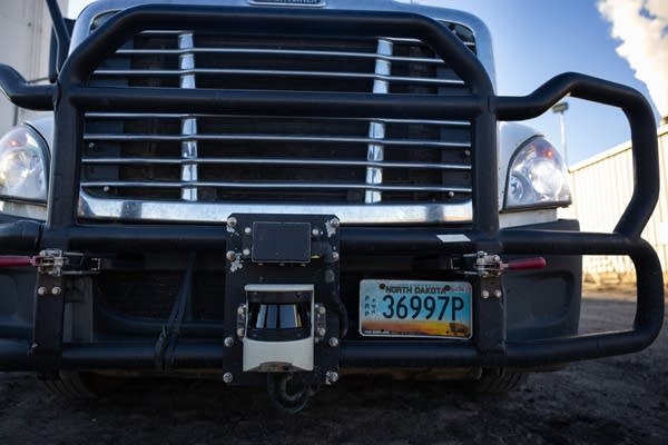 A sensor arrow mounted on the grill of a truck