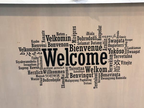 a sign says welcome in many languages