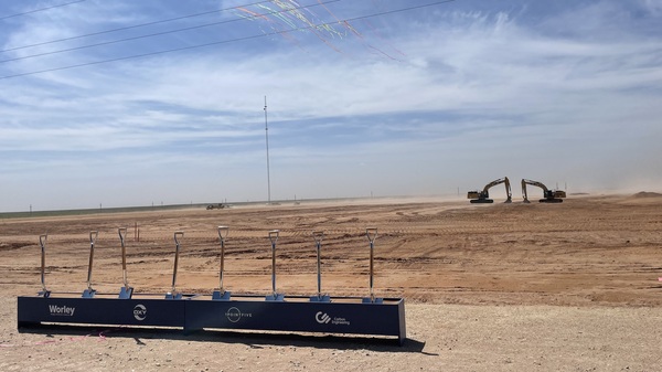 Shovels and an excavator are visible at the groundbreaking celebration for the Stratos direct air capture plant in West Texas on April 28. Construction began on the site in late 2022, and it's slated to begin operations in 2025.