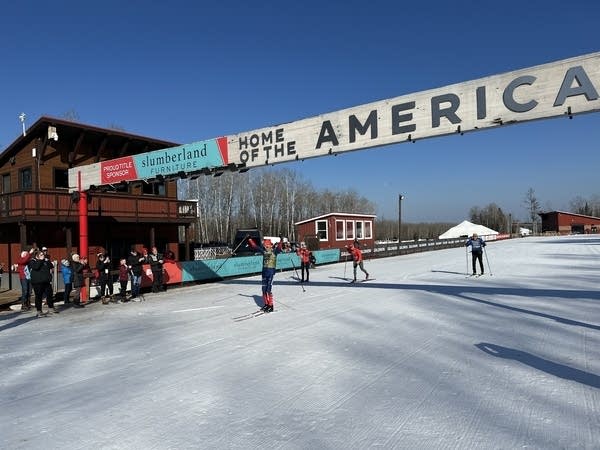 People cross country ski