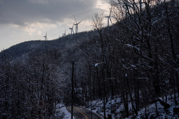 The wind turbines near Pinnacle Wind Farm dot the ridge.