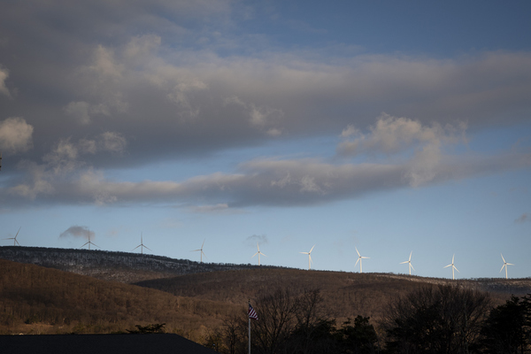 Wind turbines form a backdrop to Keyser.