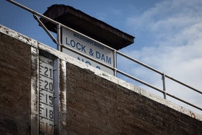 A sign reading "Mississippi River Lock & Dam"