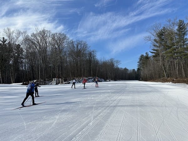 People cross country ski