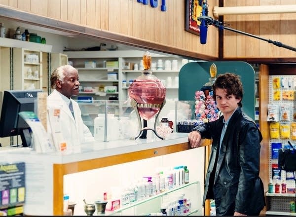 Man stands in front of pharmacy counter
