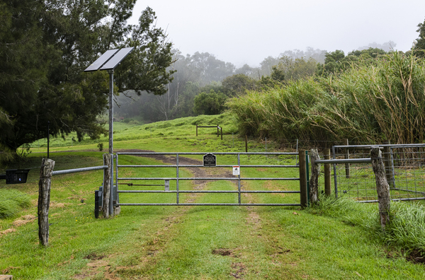 The gate to a large property in Waimea. Median home prices in the area are up 87% from pre-pandemic prices.