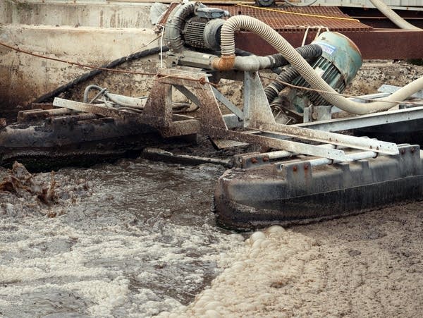 a machine floats on a water in a tank