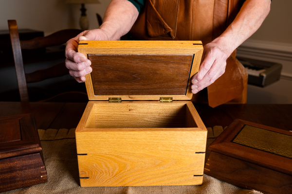 Noffsinger opens a wooden box that he made using a SawStop table saw, which uses technology to prevent serious injury.