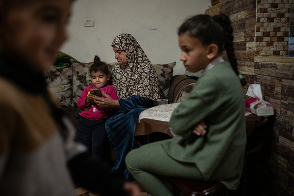 Members of the Zeita family spend time together at their home in the Palestinian village of Ein 'Arik in the occupied West Bank on March 24.