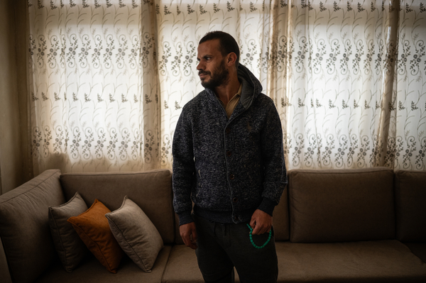 Issa Zeita, who has been unemployed since October 7, stands for a portrait at his relative's home in the Palestinian village of Ein 'Arik in the occupied West Bank on March 24.